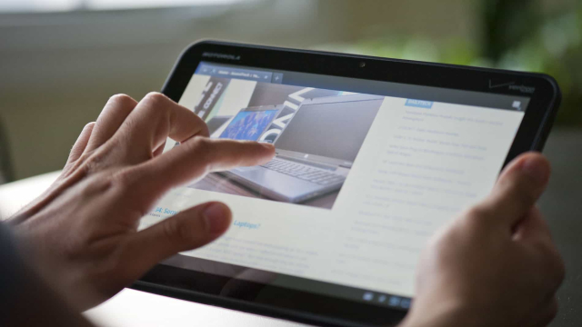 a-person-touching-an-ipad-screen