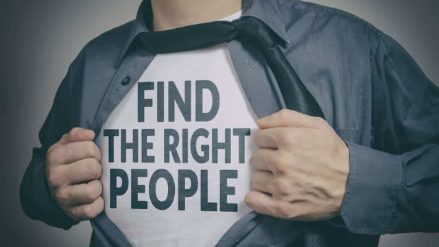 man opening shirt revealing a message, "find the right people"